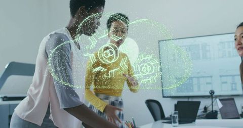 Women engaging with futuristic cloud projection in modern office