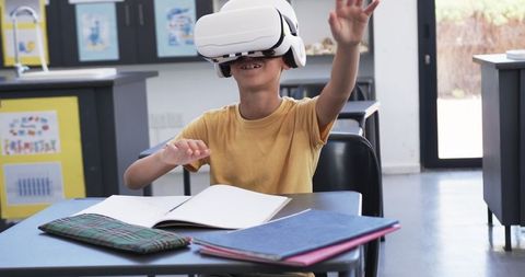 Boy Engaged with Virtual Reality in Classroom Setting