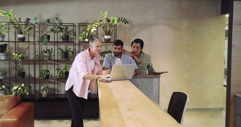 Team collaboration in creative office setting