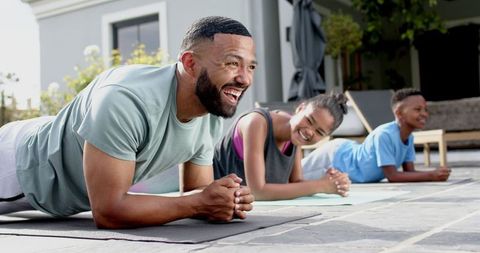 Happy African American Family Exercising Together in Park Setting - Download Free Stock Images Pikwizard.com