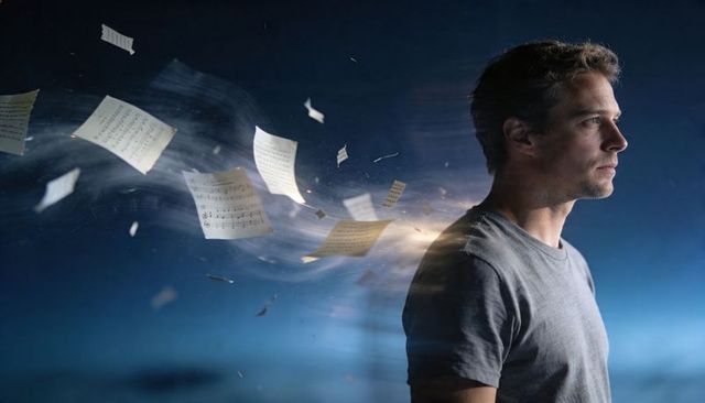 Contemplative man with swirling sheet music and motion blur, creative imagination concept