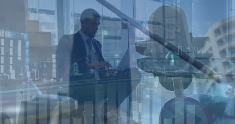 Businessman with Laptop and Financial Graphs Overlaying