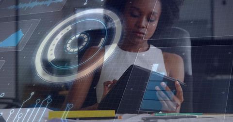 Woman studying with tablet in folio and holographic AR HUD at modern workspace
