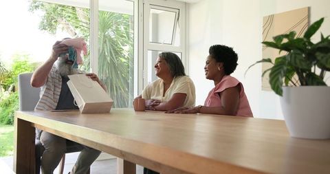 Family Celebrates Special Moment with Joy and Laughter at Home