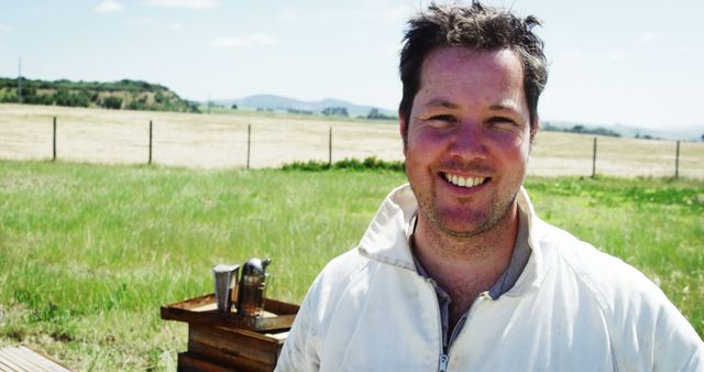 Happy Beekeeper Smiling in Meadow on Sunny Day - Download Free Stock Images Pikwizard.com