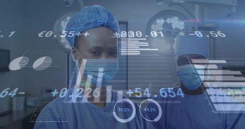 Monitoring surgical team wearing masks reviewing augmented reality data overlays in operating room