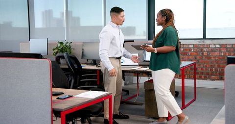 Colleagues collaborating in modern office indoor setting