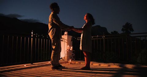 Romantic evening terrace proposal under moonlight
