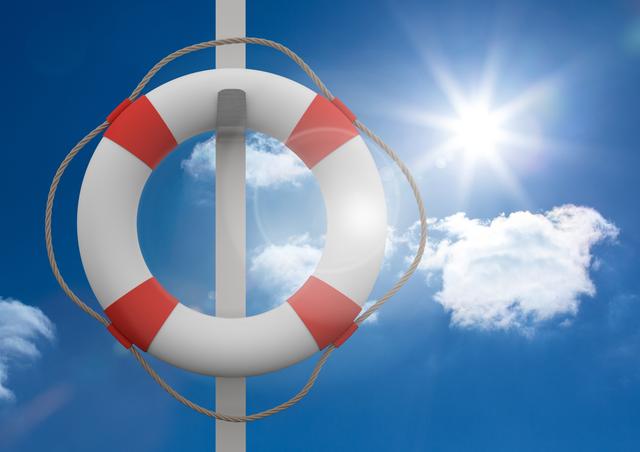 Lifebuoy hanging on a pole with bright blue sky and white clouds. Ideal for themes related to safety, rescue operations, nautical contexts, water sports, and summer. Useful for educational materials on safety procedures or to create awareness on outdoor activities.
