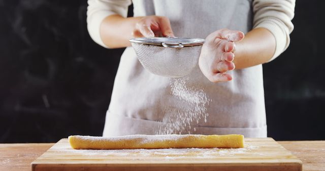 Baker Sifting Powdered Sugar onto Dough in Kitchen - Download Free Stock Images Pikwizard.com
