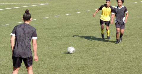 Dynamic soccer match with players focused on strategy