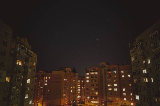 Quiet Urban Nightscape with Residential Buildings and Starry Sky - Download Free Stock Photos Pikwizard.com
