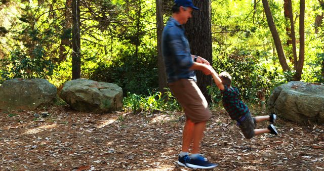 Father and Son Playing in Forest on Sunny Day - Download Free Stock Images Pikwizard.com