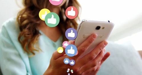 Woman using smartphone with social media like icons - Download Free Stock Images Pikwizard.com