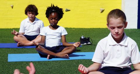Diverse Children Practicing Yoga Outdoors in Peaceful Meditation