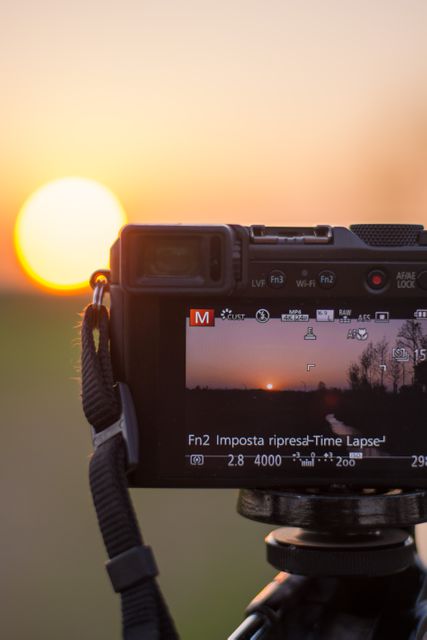 Capturing Sunset with Digital Camera on Tripod - Download Free Stock Photos Pikwizard.com