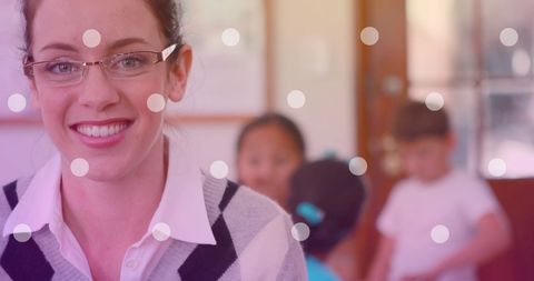 Smiling Teacher with Schoolchildren Celebrating National Teacher Day