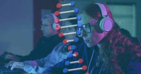 Focused female researcher analyzing genome data with dna overlay