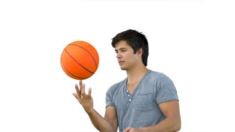 Man Mastering Basketball Finger Spin on White Background