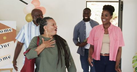 Happy African American Family Arriving at a House Party Celebration