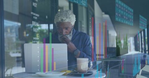 Business Professional Analyzing Data at Coffee Shop
