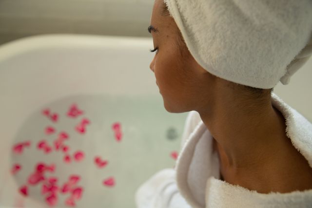 Woman Relaxing in Bathtub with Rose Petals - Download Free Stock Photos Pikwizard.com