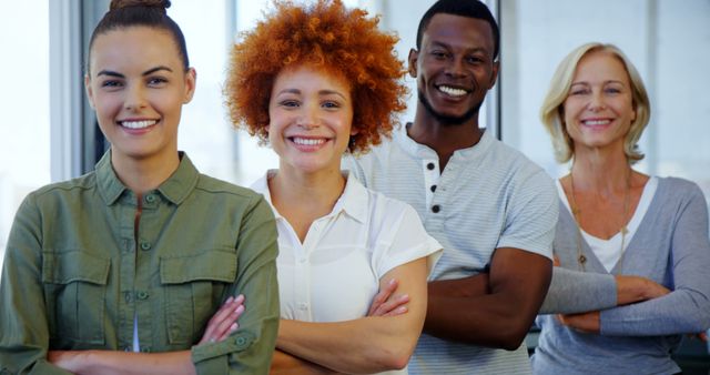 Diverse Smiling Colleagues Standing Confidently with Arms Crossed in Modern Office - Download Free Stock Images Pikwizard.com