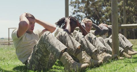 Fit Soldiers Performing Sit-Ups Outdoors at Boot Camp - Download Free Stock Images Pikwizard.com