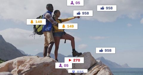 Couple Hiking On Cliff With Social Media Engagement