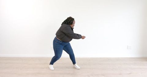 Energetic Dance Moves in Bright Minimalist Room
