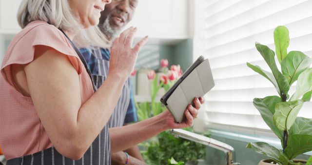 Senior Couple Video Calling with Tablet in Kitchen - Download Free Stock Images Pikwizard.com