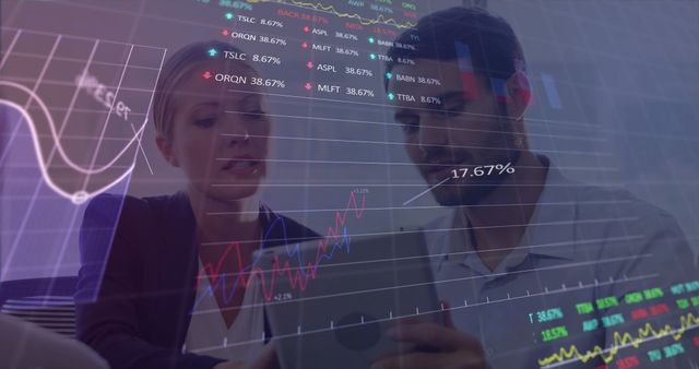 Two Professionals Analyzing Financial Data on Tablet - Download Free Stock Images Pikwizard.com