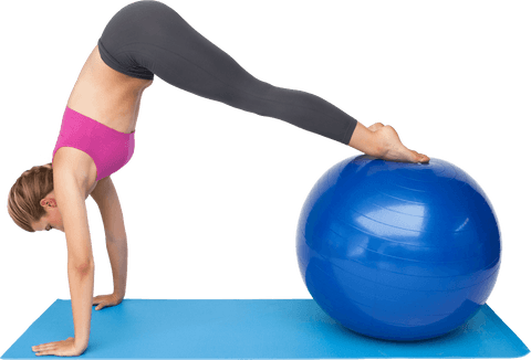 Woman practicing yoga stretch with transparent fitness ball