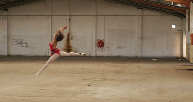Ballet dancer performing leap in abandoned warehouse - Download Free Stock Images Pikwizard.com