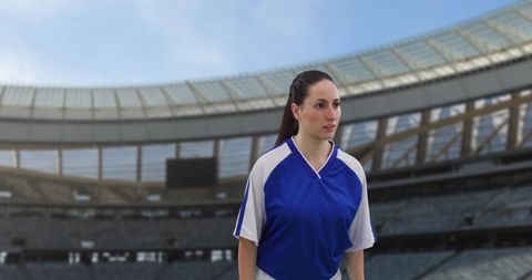 Female Soccer Player in Stadium with Determined Expression