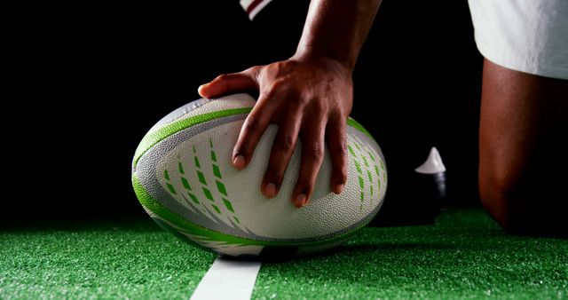 Close-Up of Rugby Player Placing Ball on Field - Download Free Stock Images Pikwizard.com