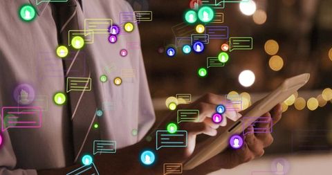 Hands typing on tablet with digital notifications overlay