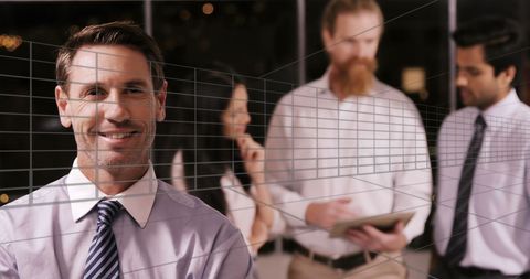 businessman smiling in modern office with holographic interface - Download Free Stock Images Pikwizard.com