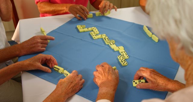 Senior Group Playing Dominos Together - Download Free Stock Images Pikwizard.com