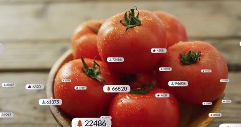 Ripe tomatoes showcasing social media notification overlays on rustic wooden table