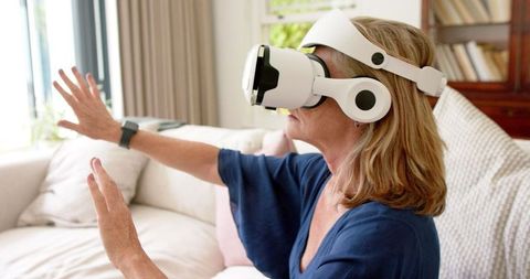 Middle-aged Woman Exploring Virtual Reality Technology at Home