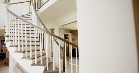 Elegant spiral staircase in modern luxurious home interior