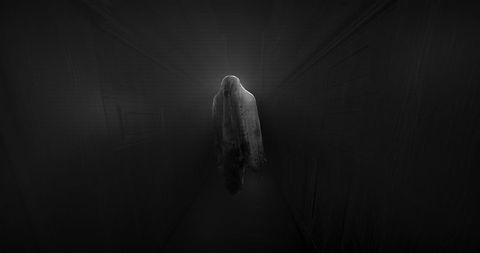 Ethereal Ghost Hovers in Dark Corridor for Halloween Theme