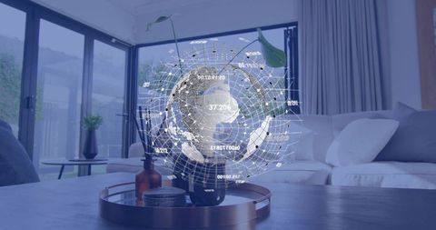 Holographic globe projecting above plant on coffee table in modern minimalist living room