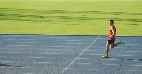 Caucasian Male Sprinter on Athletic Track Field - Download Free Stock Images Pikwizard.com