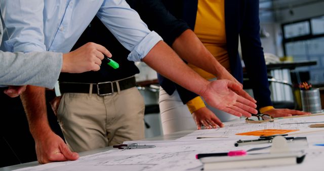 Team Collaborating on Project Plans in Modern Office Environment - Download Free Stock Images Pikwizard.com