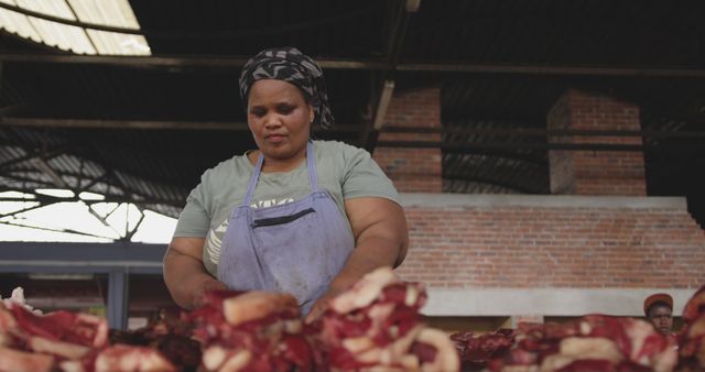 Butcher Wearing Apron Organizing Meat in Market - Download Free Stock Images Pikwizard.com