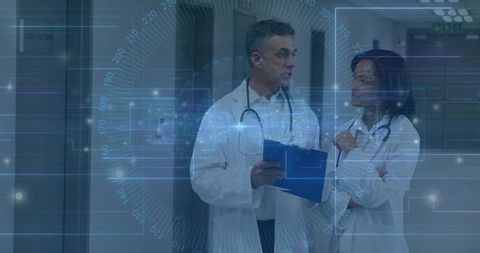 Doctors consulting in hospital with digital HUD overlay, clinical analytics and interface