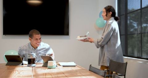 Joyful Office Celebration with Cakes and Balloons