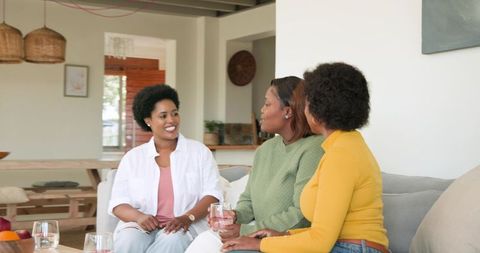 Women Socializing in Modern Living Room for Relaxation and Connection